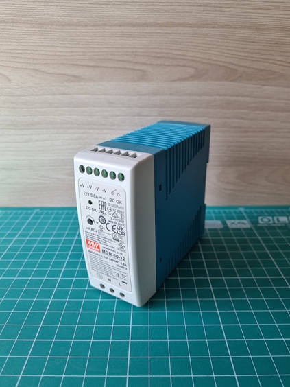 Блок питания Mean Well AC-DC, 60Вт, вход 85-264V AC, 47-63Гц,120-370В DC, выход 12В,0-5A, рег. вых=0-+20%Uном, в кожухе на DIN-рейку